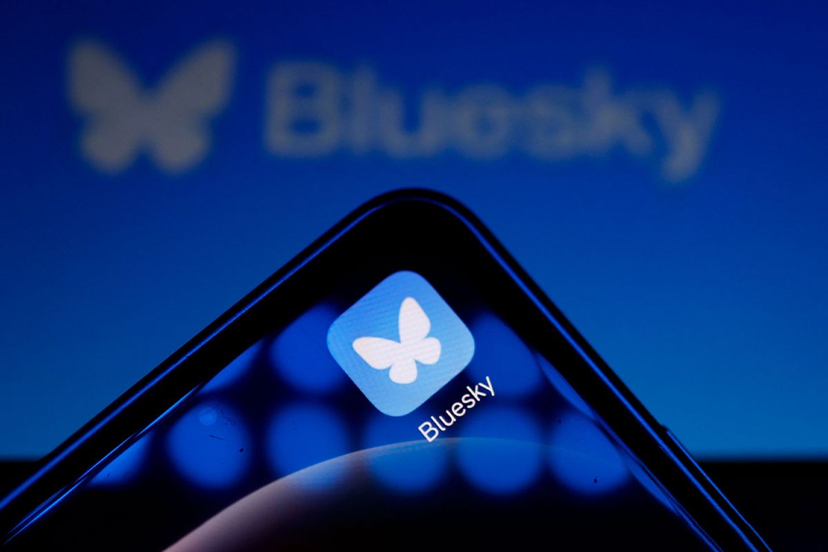 Logo of social media platform Bluesky displayed on a mobile telephone (IAN LANGSDON/AFP via Getty Images)