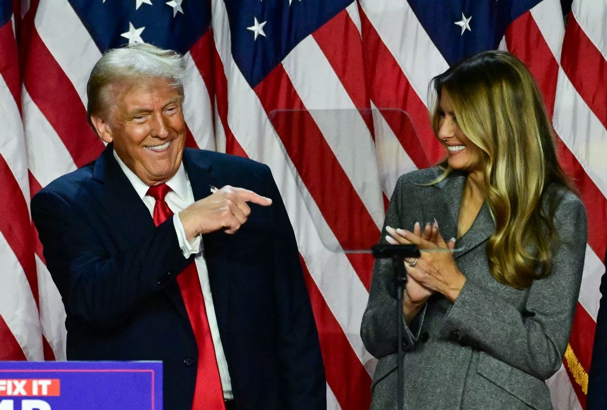 President-elect Donald Trump points to his wife Melania Trump during an election night event in West Palm Beach, Florida, on November 6, 2024.  (JIM WATSON/AFP via Getty Images)