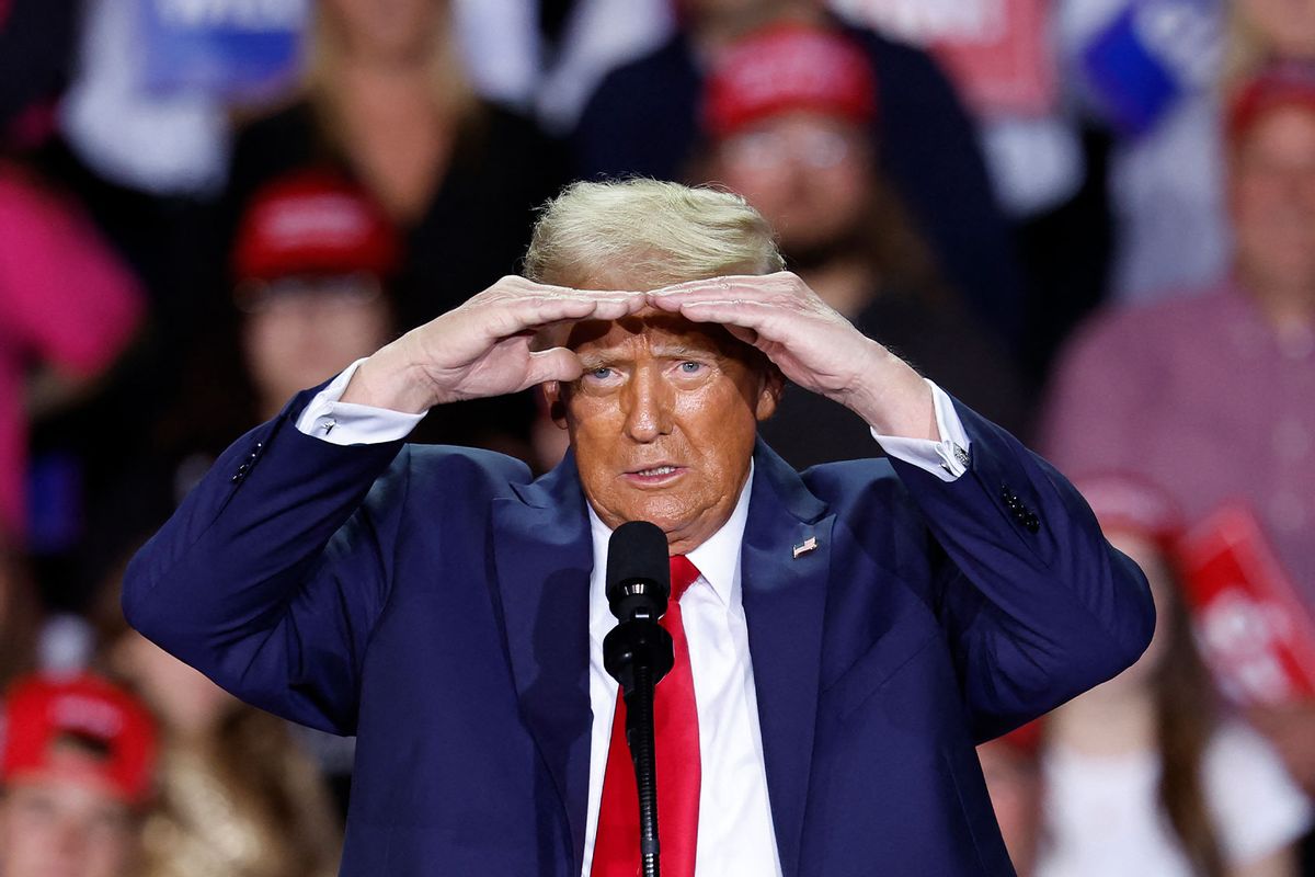 Former US President and Republican presidential candidate Donald Trump gestures as he speaks during a campaign rally at Van Andel Arena in Grand Rapids, Michigan on November 5, 2024. (KAMIL KRZACZYNSKI/AFP via Getty Images)