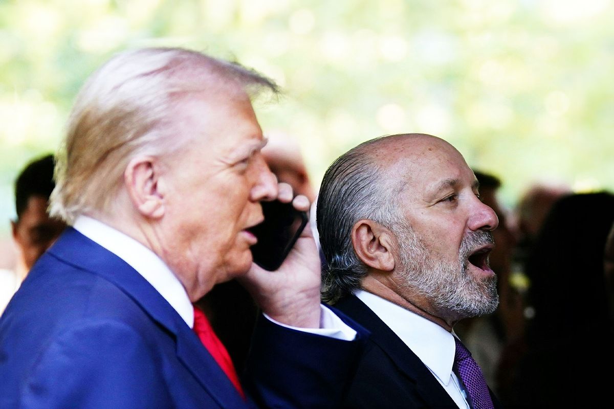 Howard Lutnick, CEO of Cantor Fitzgerald and former US President and Republican presidential candidate Donald Trump (L) attend a remembrance ceremony on the 23rd anniversary of the September 11 terror attack on the World Trade Center at Ground Zero, in New York City on September 11, 2024. (ADAM GRAY/AFP via Getty Images)