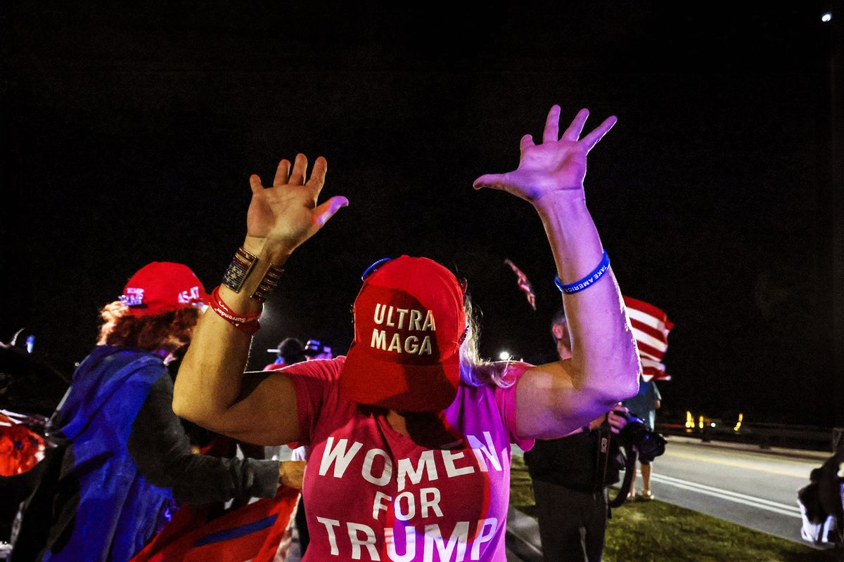 A supporter of former US president and Republican presidential candidate Donald Trump gestures as they gather near his Mar-a-Lago resort in Palm Beach, Florida, on Election Day, November 5, 2024. (GIORGIO VIERA/AFP via Getty Images)