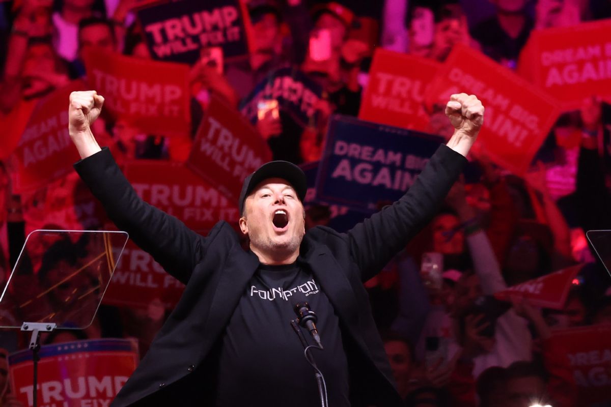 Tesla and X CEO Elon Musk raises his hands as he takes the stage during a campaign rally for Republican presidential nominee, former U.S. President Donald Trump, at Madison Square Garden on October 27, 2024 in New York City.  (Michael M. Santiago/Getty Images)