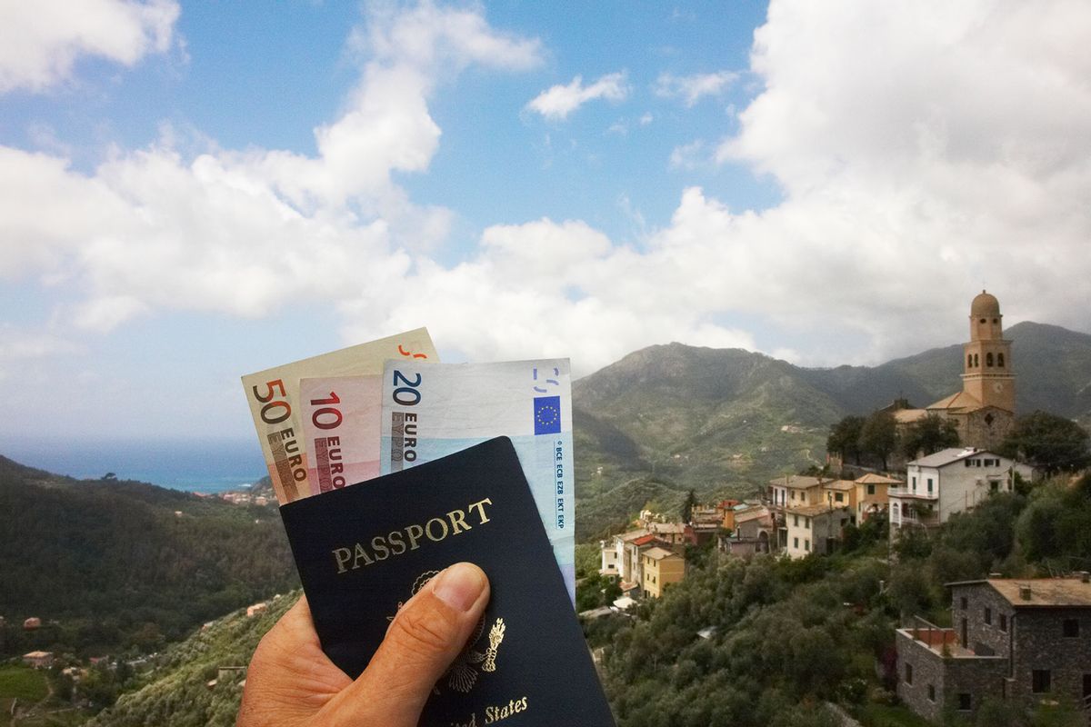 Man holding passport and euro currency (Getty Images/Rolf Bruderer)