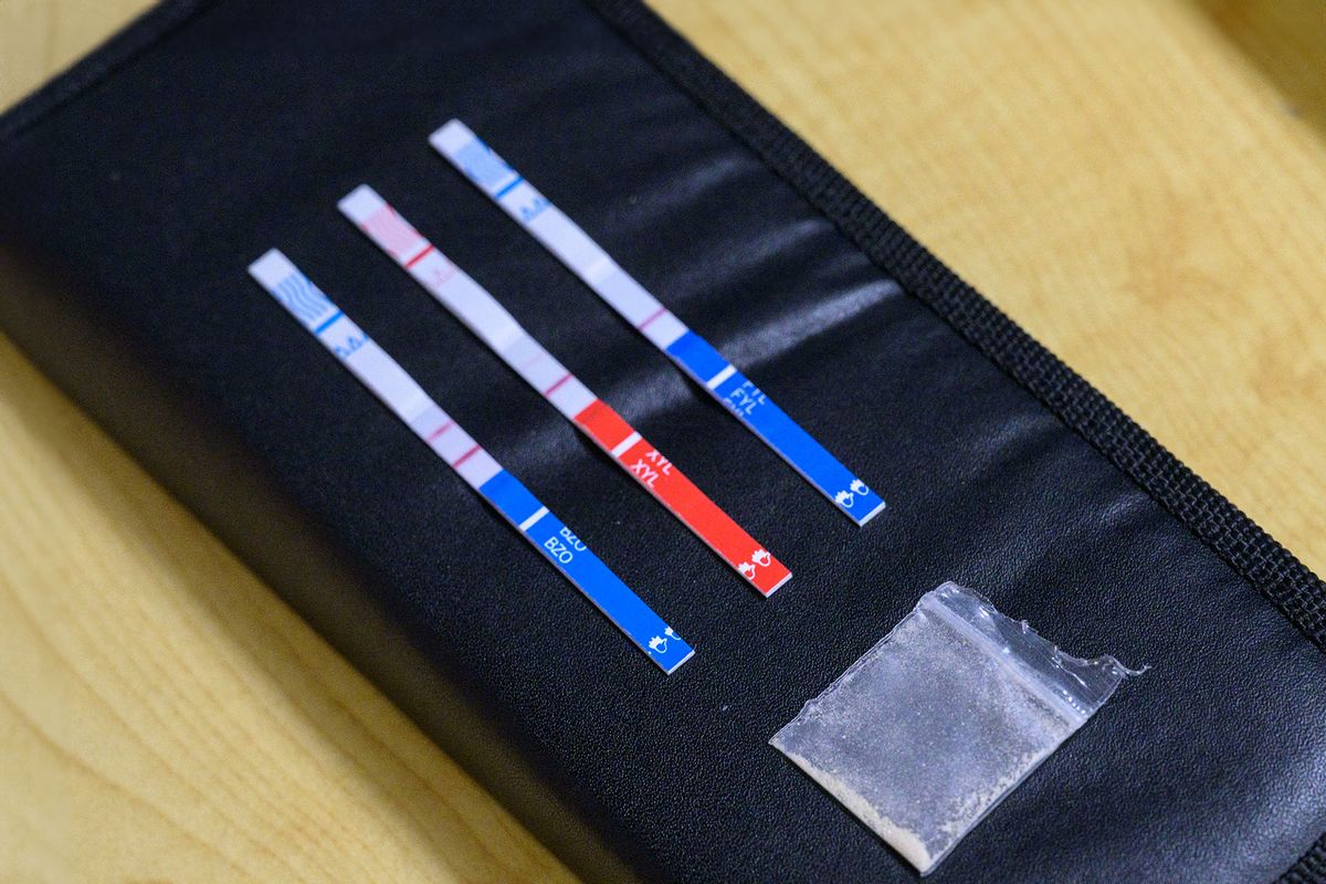 Tests strips, used to detect the presence of fentanyl and xylazine in different kinds of drugs, such as cocaine, methamphetamine, and heroin, lay next to a bag of heroin at St. Ann's Corner of Harm Reduction in New York City on May 25, 2023. (ANGELA WEISS/AFP via Getty Images)