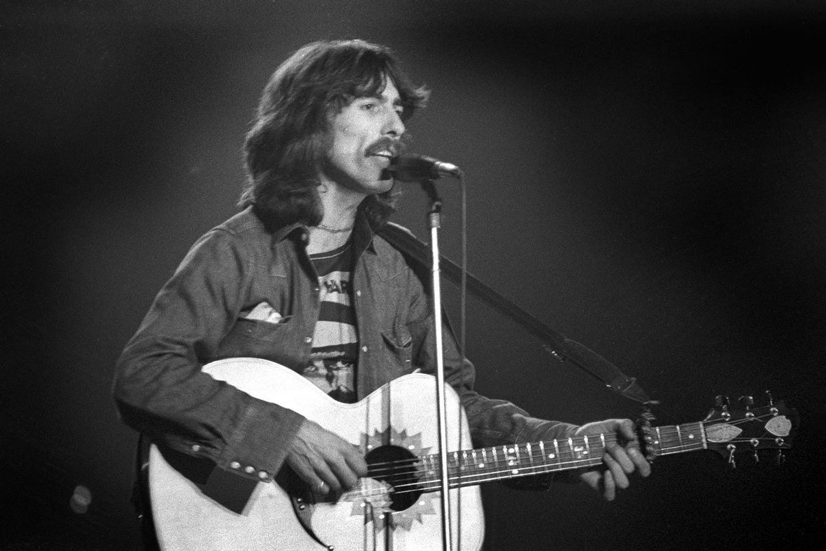 English Pop and Rock musician George Harrison (1943 - 2001) plays guitar as he performs onstage at Olympia Stadium, Detroit, Michigan, December 4, 1974. (Steve Kagan/Getty Images)