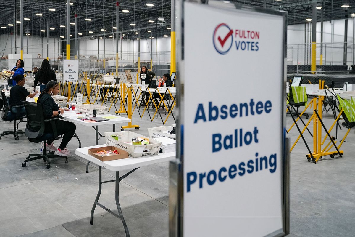 Fulton County elections workers process absentee ballots at the new Fulton County Elections Hub and Operations Center on November 4, 2024, in Union City, Georgia. (ELIJAH NOUVELAGE/AFP via Getty Images)