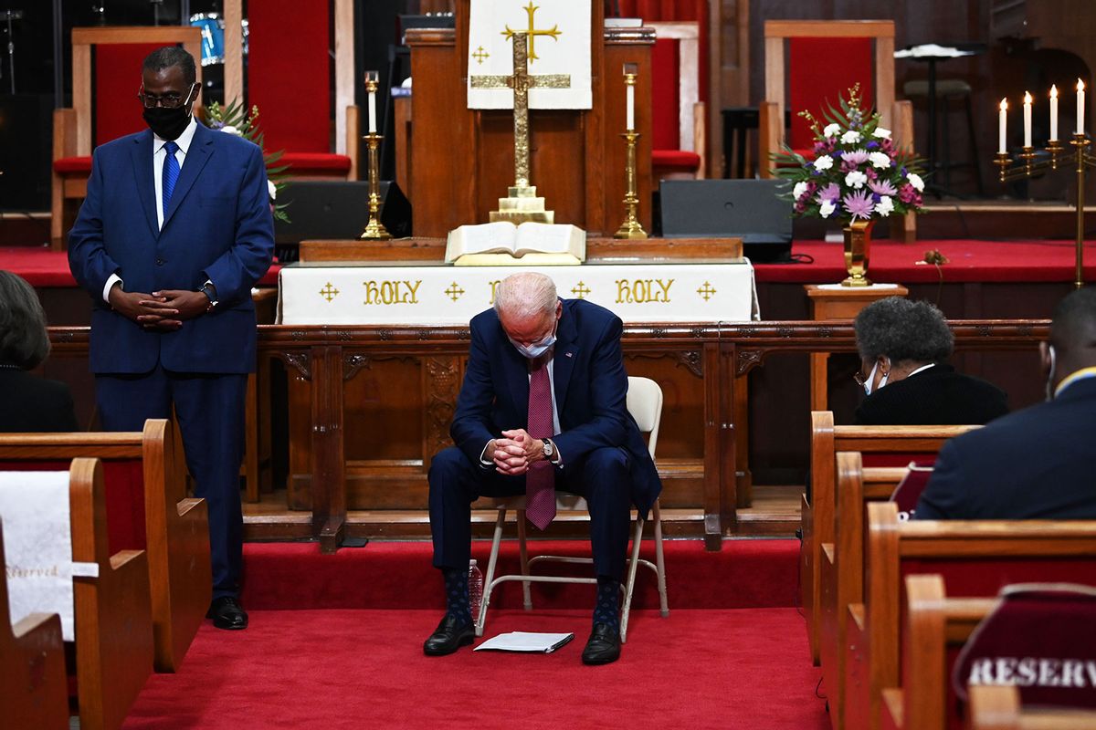 Former vice president and Democratic presidential candidate Joe Biden(C) prays as he meets religious leaders at Bethel AME Church in Wilmington, Delaware on June 1, 2020. (JIM WATSON/AFP via Getty Images)