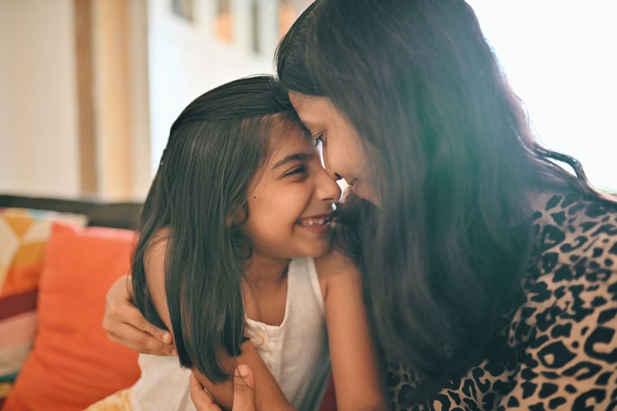 Mother and daughter hugging (Getty Images/Mayur Kakade)