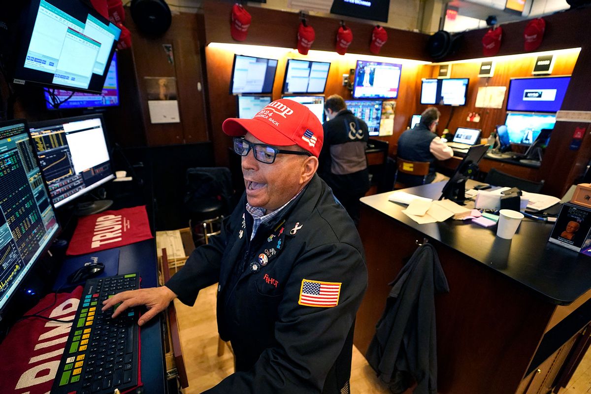 A trader wears a Trump hat as he works on the floor of the New York Stock Exchange (NYSE) at the opening bell on November 6, 2024, in New York City. (TIMOTHY A. CLARY/AFP via Getty Images)