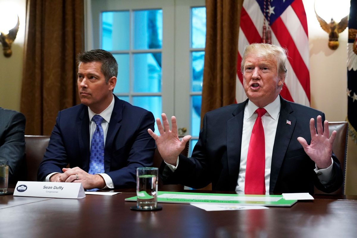 Donald Trump, with Sean Duffy (L), speaks in the Cabinet Room of the White House on January 24, 2019.  (MANDEL NGAN/AFP via Getty Images)