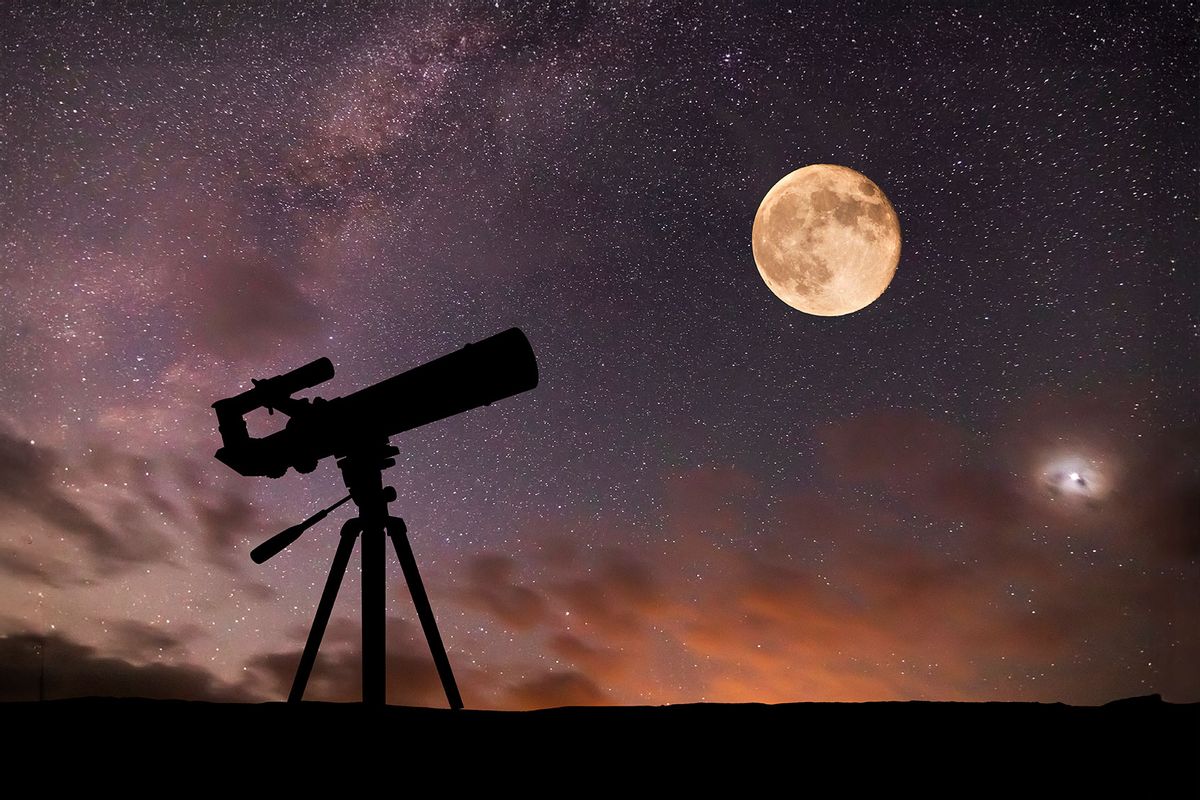 Telescope on the background of the starry sky and moon. (Getty Images/Anton Petrus)