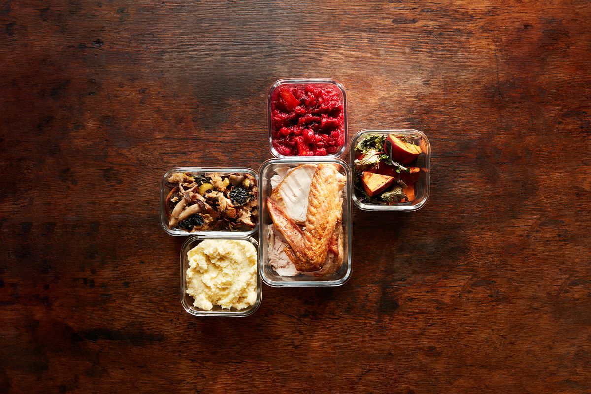 Thanksgiving leftovers, cranberry sauce, stuffing, mashed potatoes, turkey, greens and yams in containers (Getty Images/Maren Caruso)