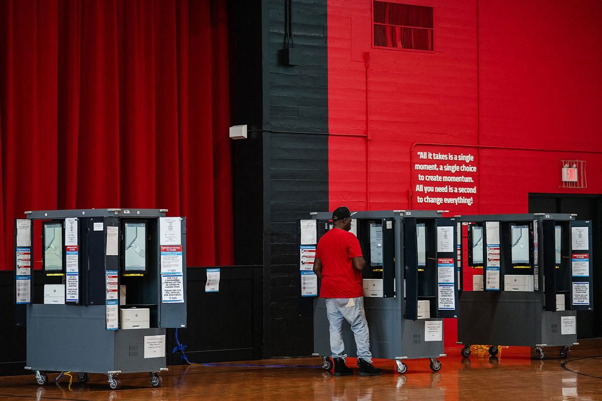 A voter casts his ballot in a polling place on Election Day in College Park, Georgia, November 5, 2024. (ELIJAH NOUVELAGE/AFP via Getty Images)