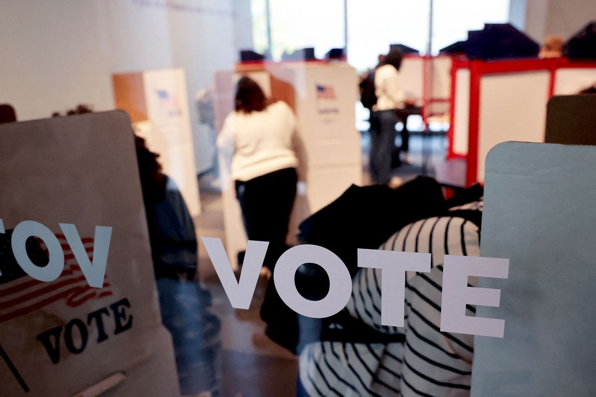 People cast their in-person early ballot for the 2024 general election at a polling station in Ann Arbor, Michigan, on October 31, 2024. (JEFF KOWALSKY/AFP via Getty Images)