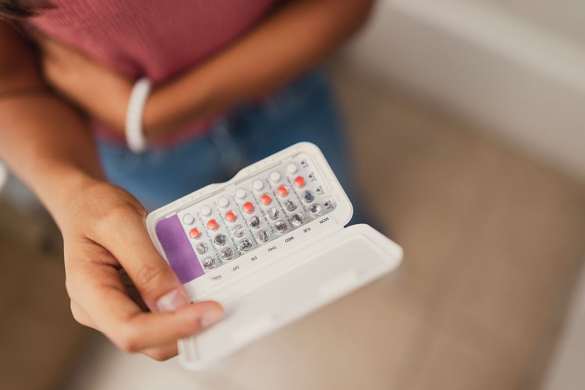 Woman Holding Birth Control Pills (Getty Images/Laura Olivas)