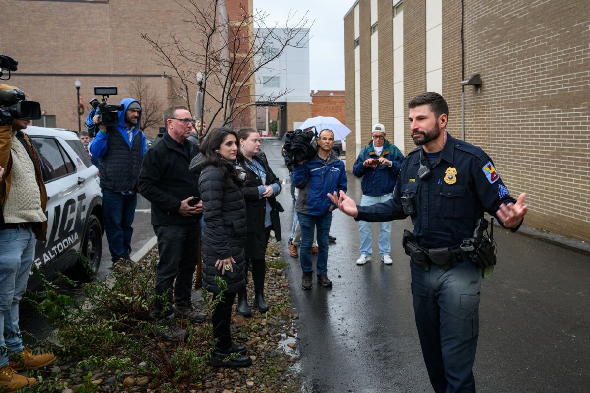 An Altoona Police officer updates members of the media outside the Altoona Police Department on December 9, 2024, in Altoona, Pennsylvania.  (Jeff Swensen/Getty Images)