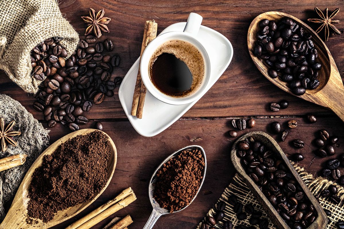 Espresso coffee cup on vintage table and assortment of grinded and roasted coffee beans (Getty Images/apomares)