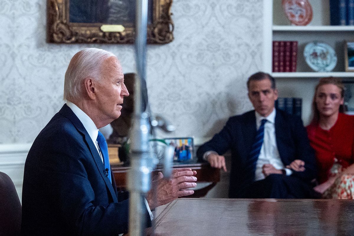 U.S. President Joe Biden, accompanied by his son, Hunter Biden, Hunter's daughter Finnegan Biden, Howard Krein, and Ashley Biden, speaks during an address to the nation about his decision not to seek reelection in the Oval Office at the White House on July 24, 2024 in Washington, DC. (Andrew Harnik/Getty Images)