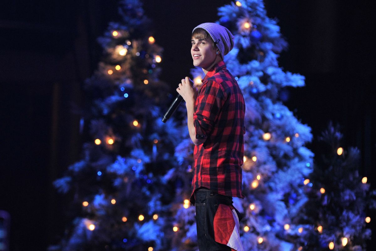 Singer Justin Bieber is home for the Holidays and performs in concert for a special acoustic Christmas show at Massey Hall on December 21, 2011 in Toronto, Canada. (George Pimentel/WireImage/Getty Images)