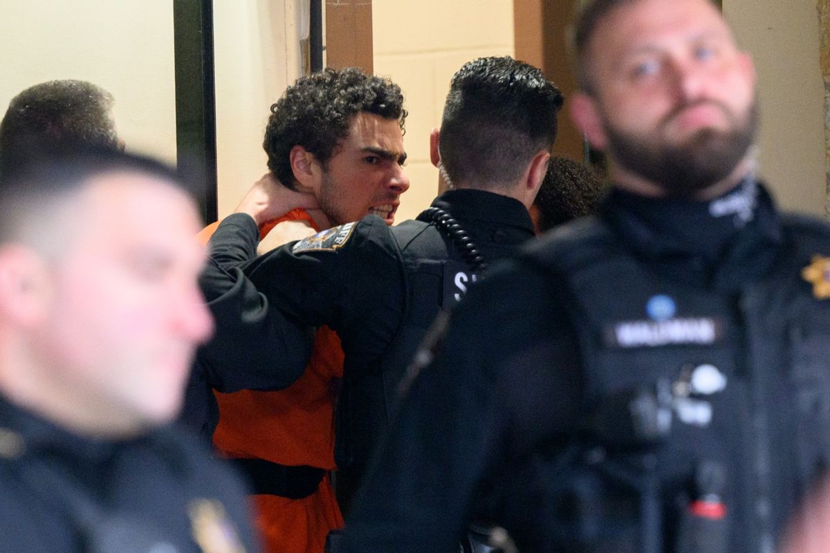 Suspected shooter Luigi Mangione is led into the Blair County Courthouse for an extradition hearing on December 10, 2024, in Hollidaysburg, Pennsylvania. (Jeff Swensen/Getty Images)