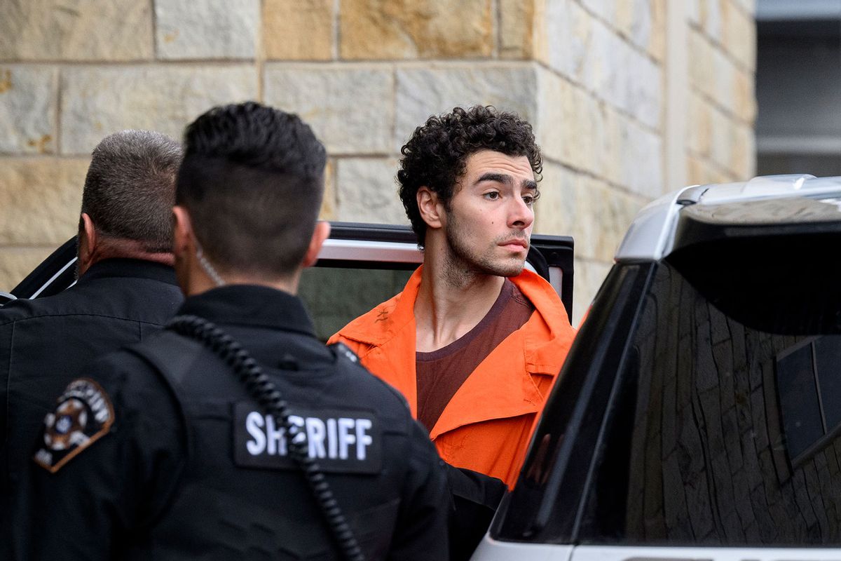 Suspected shooter Luigi Mangione is led into the Blair County Courthouse for an extradition hearing December 10, 2024 in Hollidaysburg, Pennsylvania. (Jeff Swensen/Getty Images)