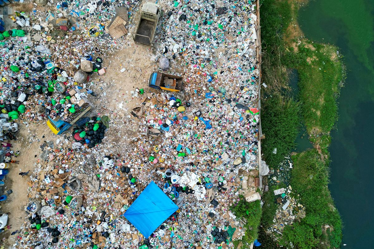 An aerial view shows plastic waste at a landfill on the outskirts of Bengaluru on November 23, 2024. (IDREES MOHAMMED/AFP via Getty Images)