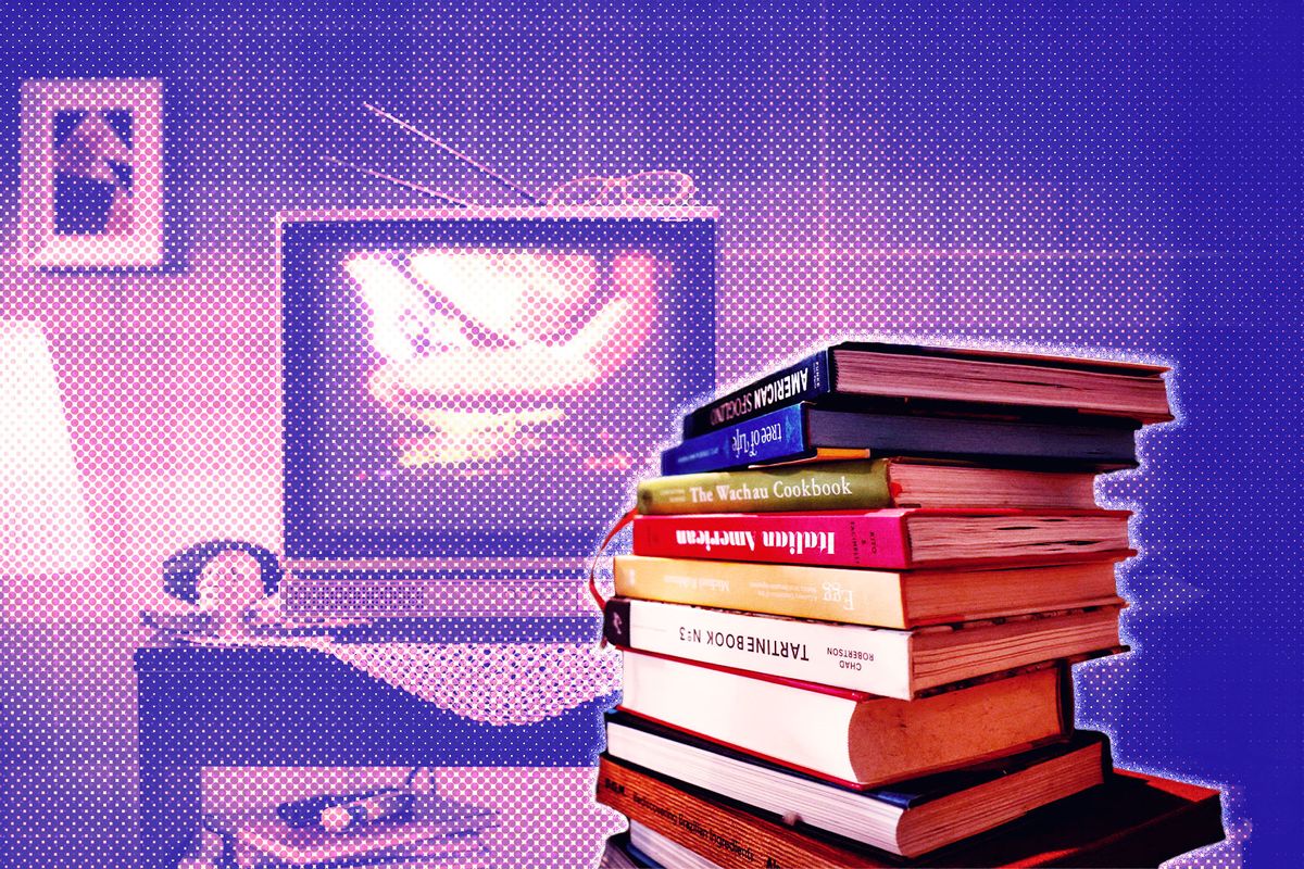 Stack of cookbooks by a television (Photo illustration by Salon/Getty Images)