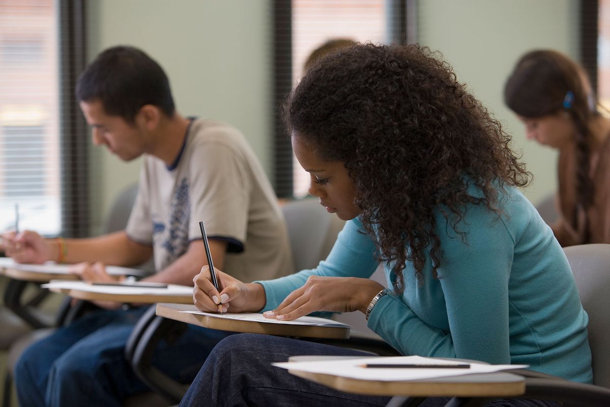 Students taking written examination (Getty Images/Commercial Eye)