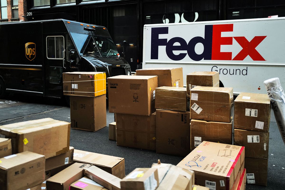 Parcels are seen in a street nearby UPS and FedEx trucks in a street of the Manhattan borough in New York City on December 4, 2023. (CHARLY TRIBALLEAU/AFP via Getty Images)