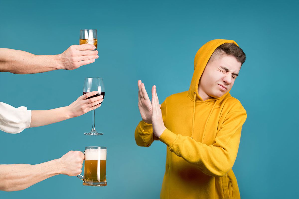 Young man refusing alcoholic drinks (Getty Images/Vyacheslav Dumchev)