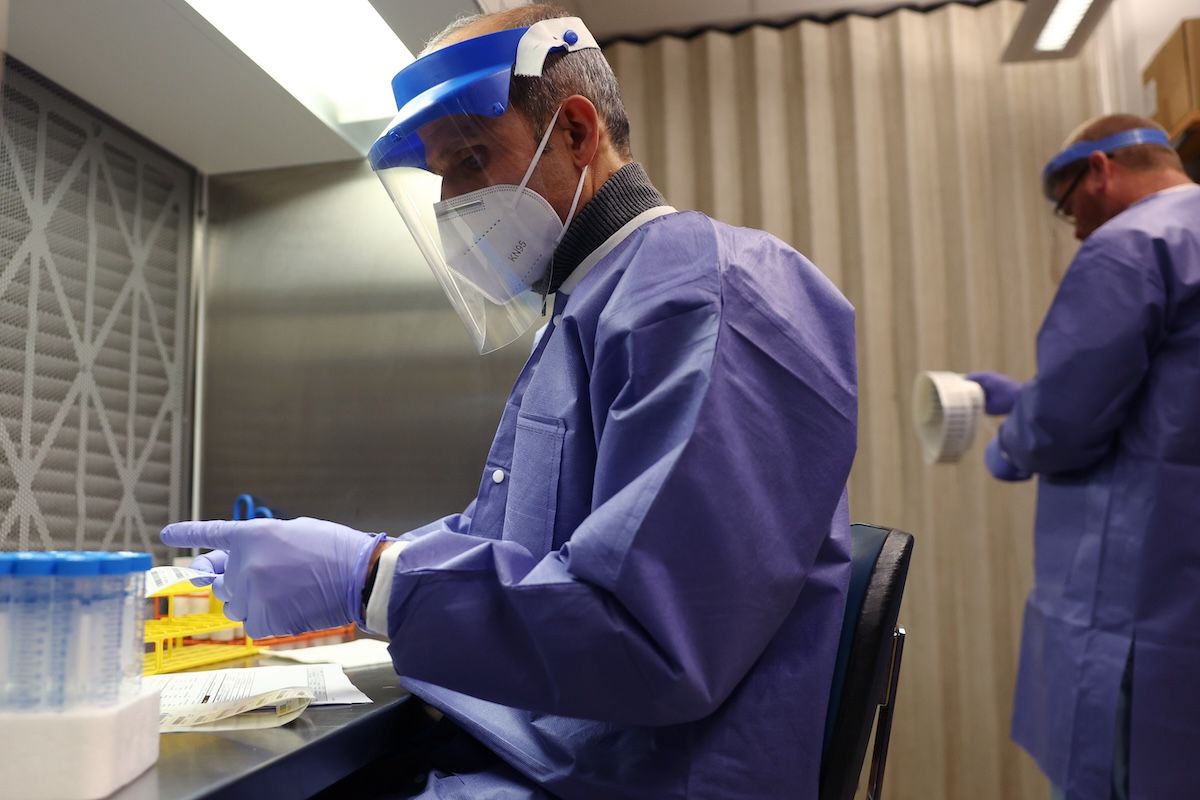 ITHACA, NEW YORK - DECEMBER 10: HDC receiving staff prep arriving milk samples for testing at the Animal Health Diagnostic Center at Cornell University on December 10, 2024 in Ithaca, New York.  (Photo by Michael M. Santiago/Getty Images)