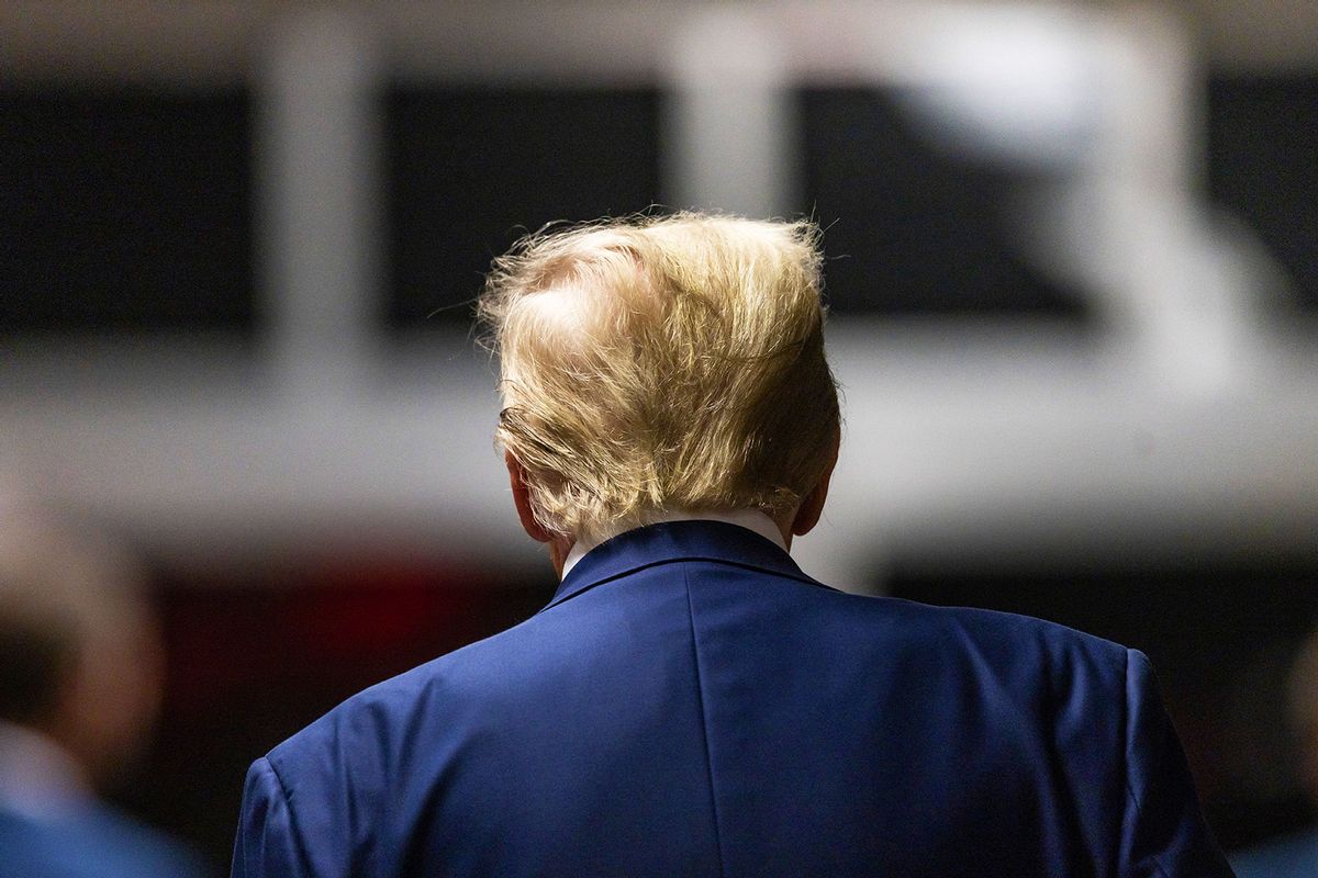 Former US President Donald Trump walks back to the courtroom after a break in his trial for allegedly covering up hush money payments linked to extramarital affairs, at Manhattan Criminal Court in New York City, on April 30, 2024. (JUSTIN LANE/POOL/AFP via Getty Images)