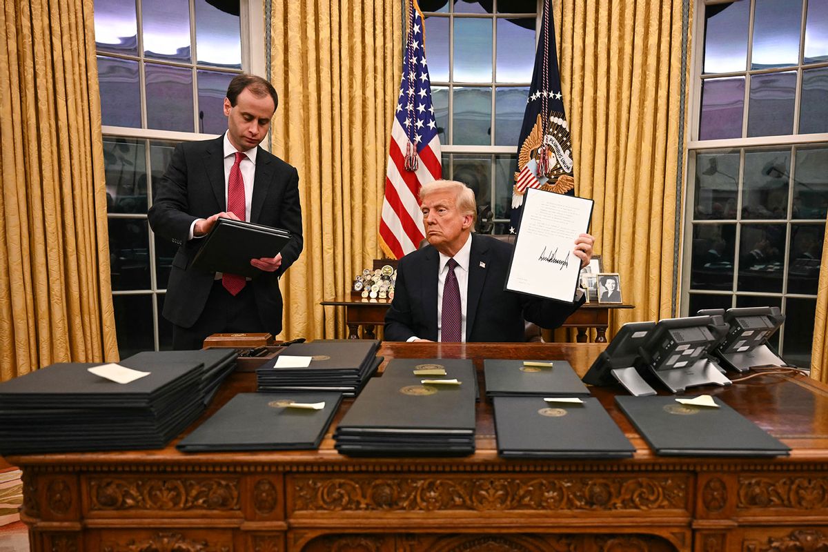 US President Donald Trump signs executive orders in the Oval Office of the White House in Washington, DC, on January 20, 2025. (JIM WATSON/POOL/AFP via Getty Images)