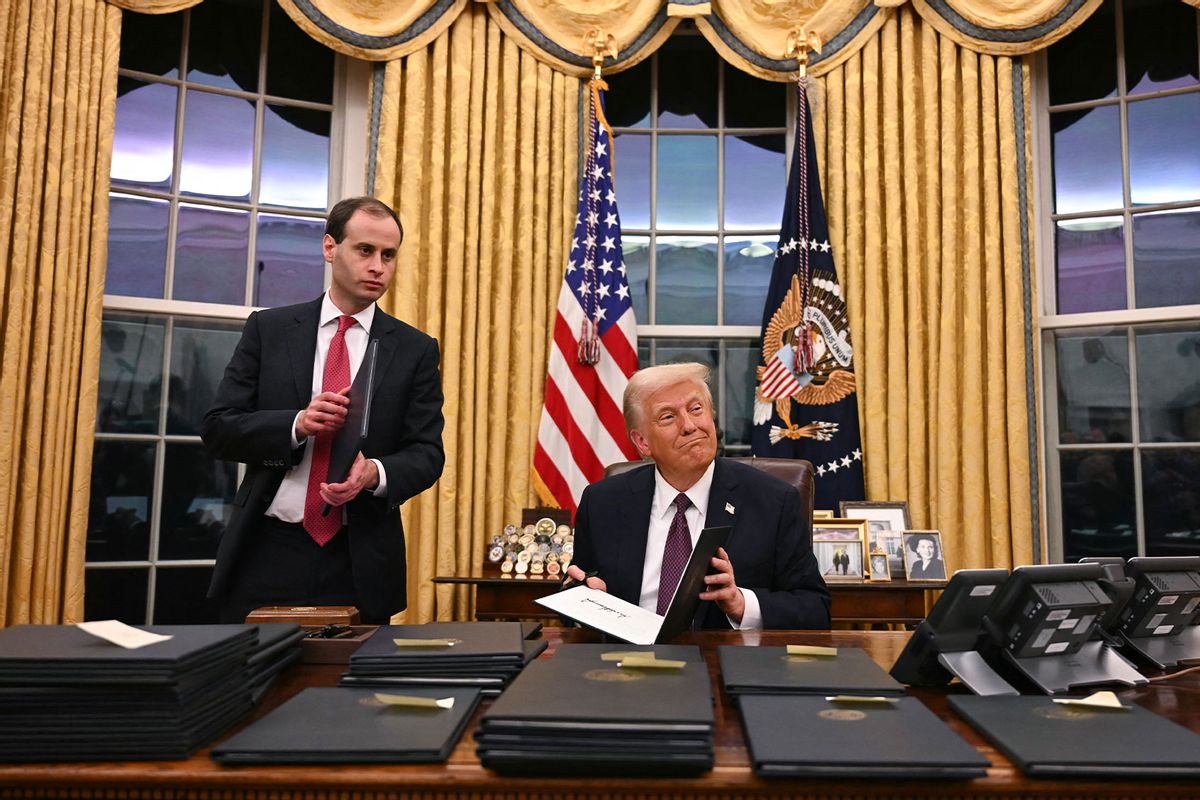 US President Donald Trump signs executive orders in the Oval Office of the White House in Washington, DC, on January 20, 2025. (JIM WATSON/AFP via Getty Images)