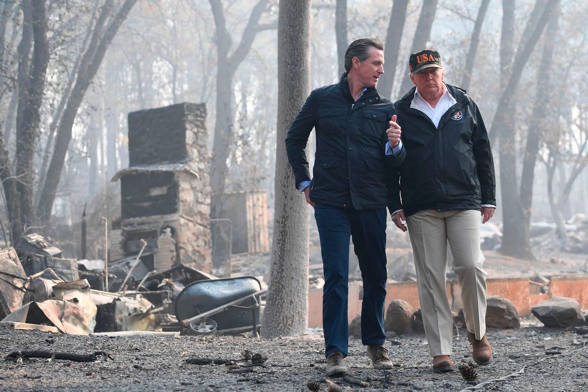 Donald Trump speaks with Gavin Newsom, as they view damage from wildfires in Paradise, California on November 17, 2018. ( Saul Loeb/AFP via Getty Images)