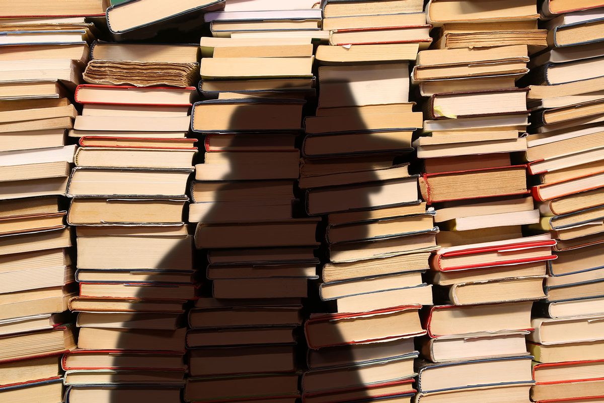 Donald Trump's shadow over a pile of books (Photo illustration by Salon/Getty Images)