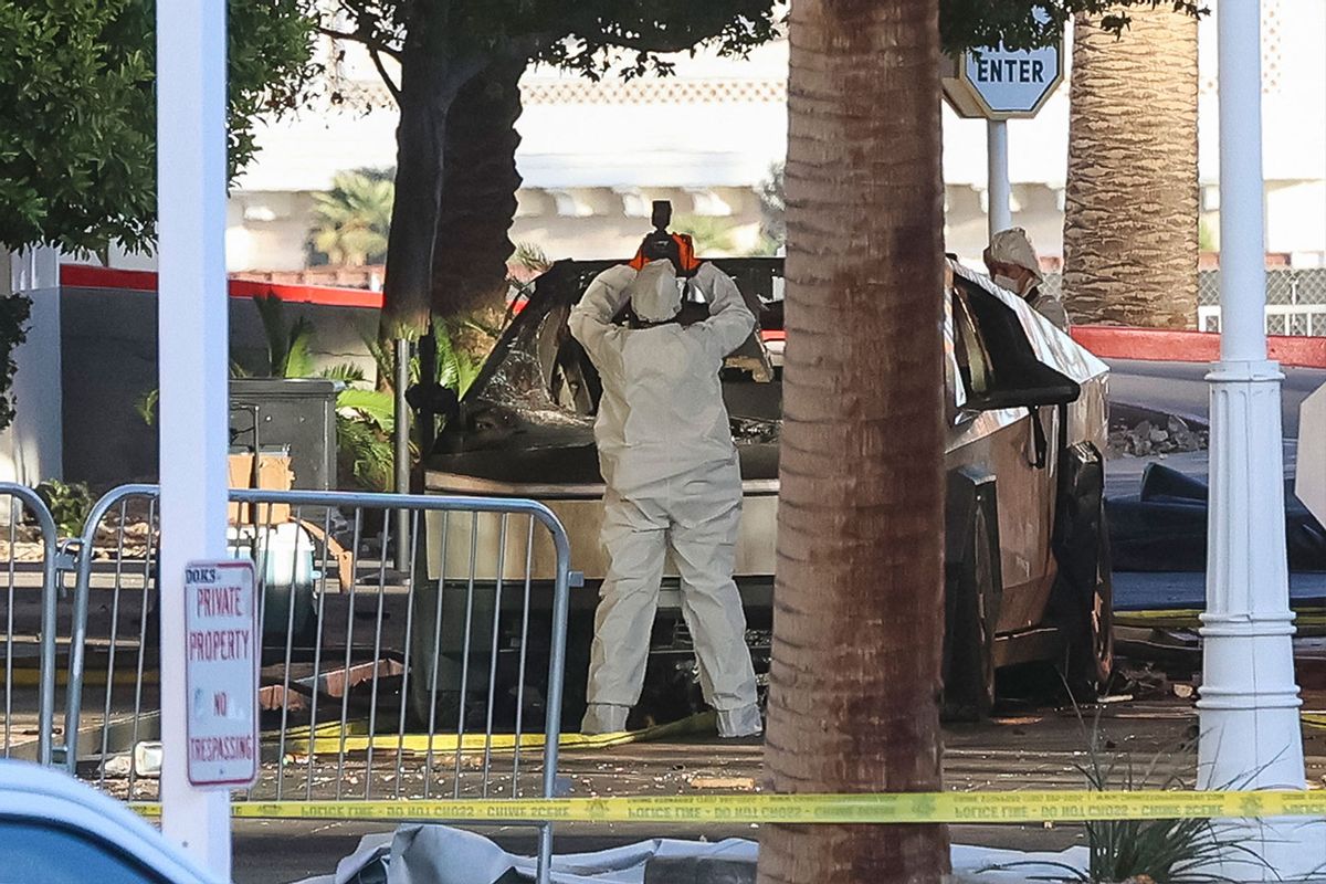 An investigator photographs a Tesla Cybertruck that exploded outside the lobby of President-elect Donald Trump's hotel on January 1, 2025, in Las Vegas. (WADE VANDERVORT/AFP via Getty Images)