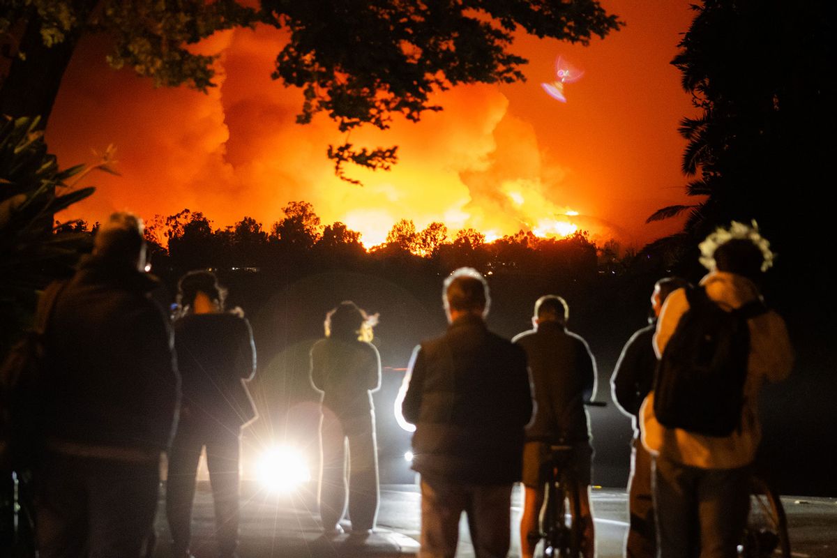 People watch the smoke and flames from the Palisades Fire in the Pacific Palisades neighborhood on January 07, 2025 in Los Angeles, California. (Tiffany Rose/Getty Images)