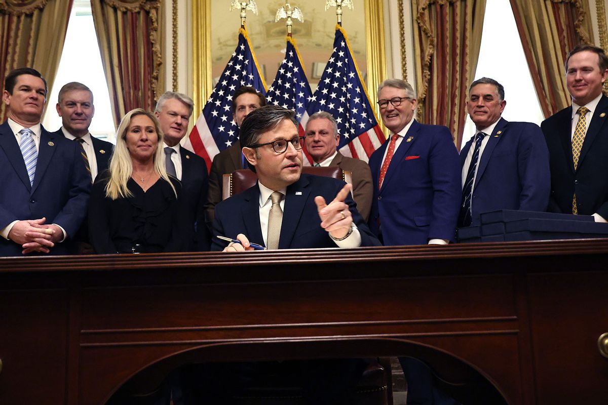 Speaker of the House Mike Johnson (R-LA) signs the Laken Riley Act during an enrollment ceremony with members of the Georgia delegation in the Speaker's ceremonial office at the U.S. Capitol on January 23, 2025 in Washington, DC. (Chip Somodevilla/Getty Images)