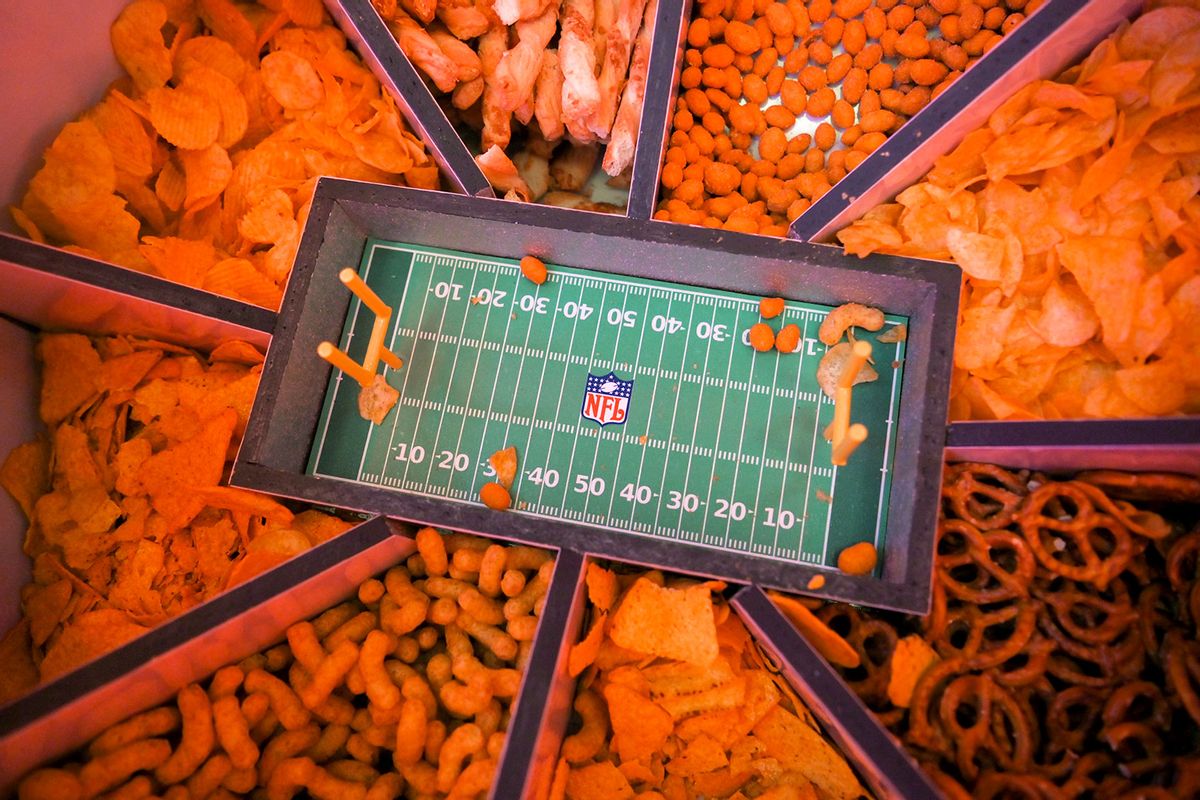 A cardboard American Football Stadium filled with snacks. (Nicolas Armer/picture alliance via Getty Images)