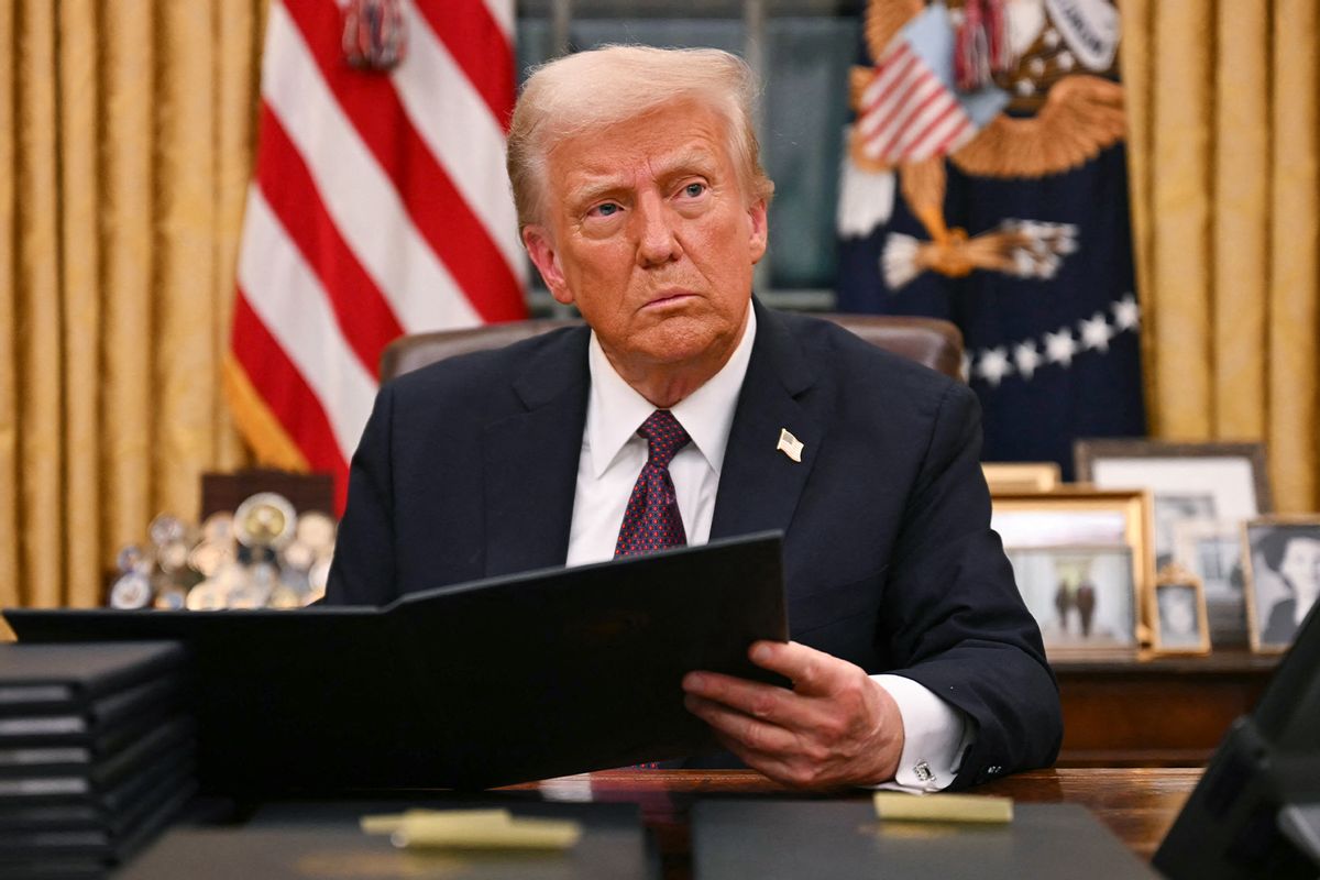 President Donald Trump signs an executive order for pardons on January 6 offenders in the Oval Office of the White House in Washington, DC, on January 20, 2025.
 (JIM WATSON/AFP via Getty Images)