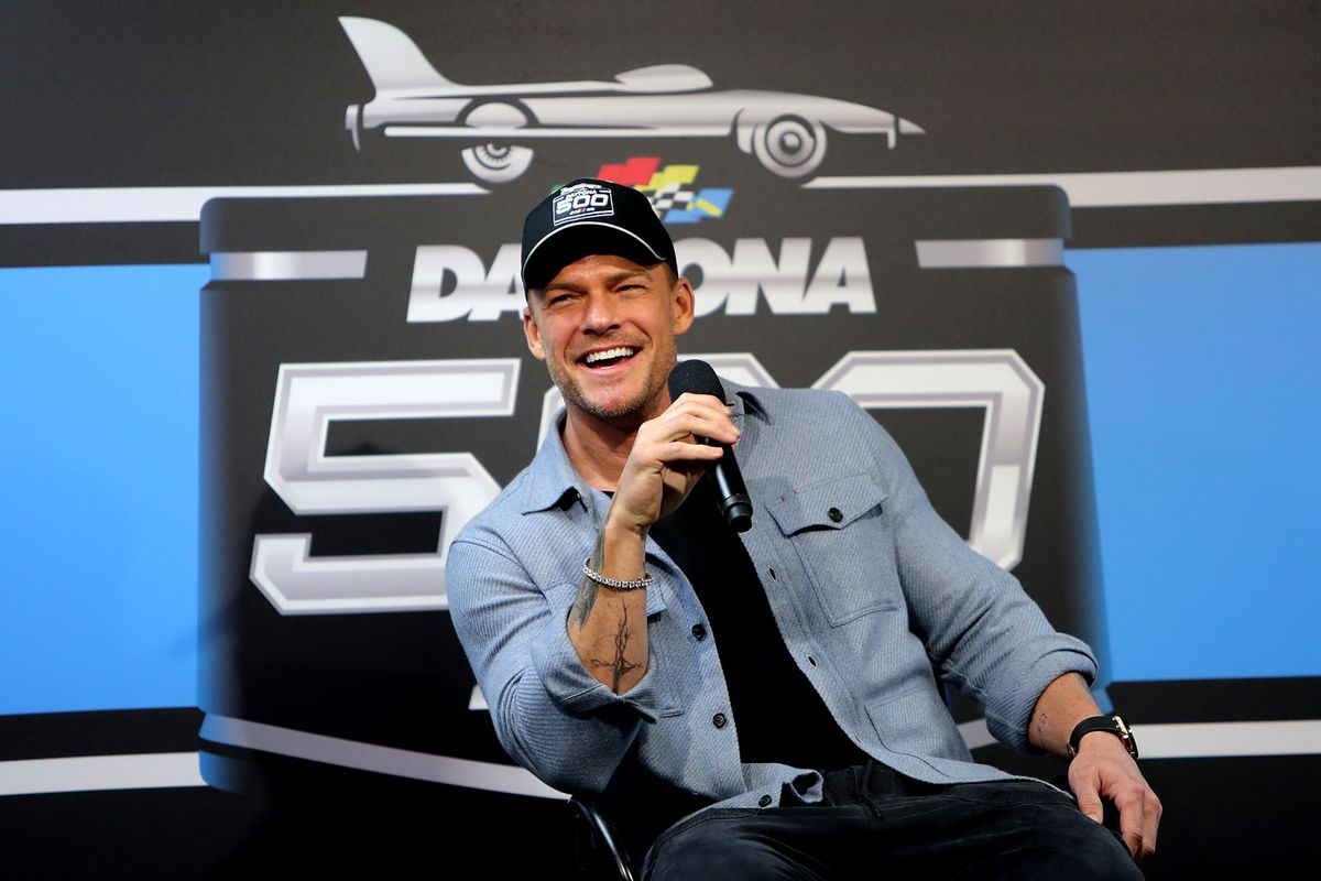 Honorary Pace Car driver Alan Ritchson talks with the media prior to the running of the NASCAR Cup Series Daytona 500 on February 16, 2025 at Daytona International Speedway in Daytona Beach, FL. (Jeff Robinson/Icon Sportswire via Getty Images)