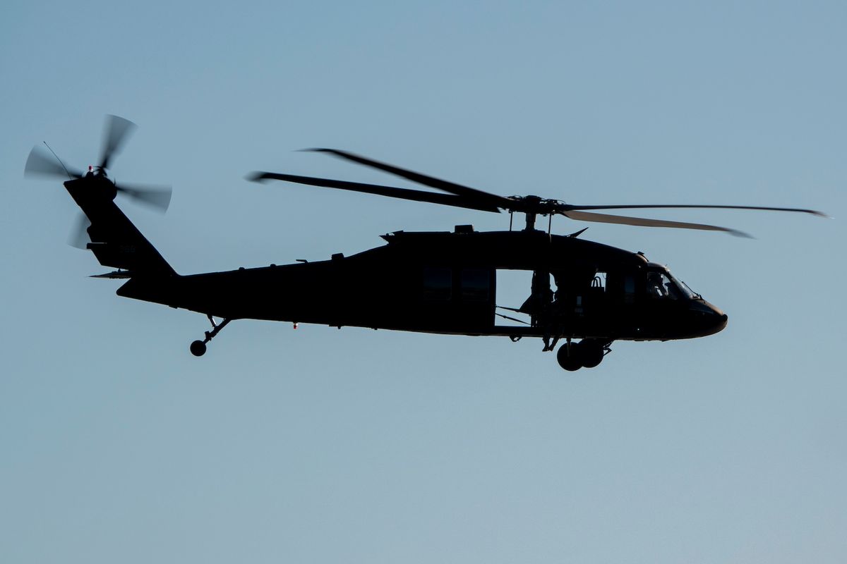 A U.S. Army Sikorsky UH-60 Black Hawk helicopter flies along the coast on November 8, 2024, in Laguna Beach, California. (Photo by Kevin Carter/Getty Images)