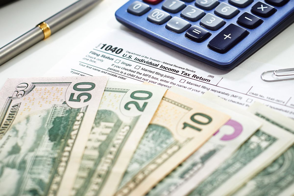 Cash, tax forms and a calculator (Getty Images/Thanasis)
