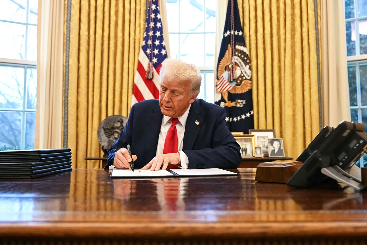 US President Donald Trump signs an executive order in the Oval Office of the White House on February 3, 2025, in Washington, DC. (JIM WATSON/AFP via Getty Images)