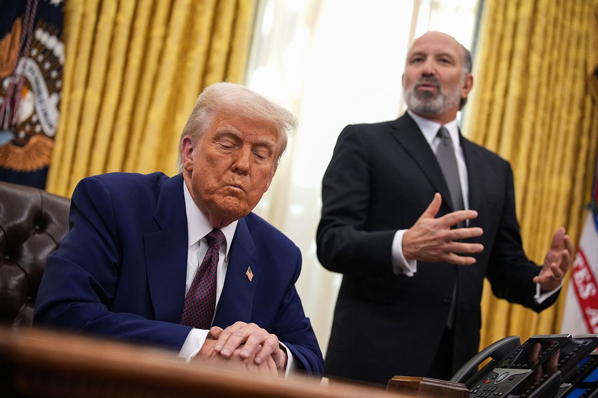 Secretary of Commerce Howard Lutnick (R) speaks alongside U.S. President Donald Trump after Trump signed an executive order on reciprocal tariffs in the Oval Office at the White House on February 13, 2025 in Washington, DC. (Andrew Harnik/Getty Images)