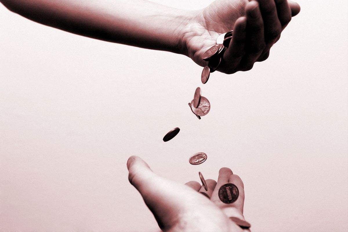 Money falling from one hand to another (Getty Images/Jitalia17)