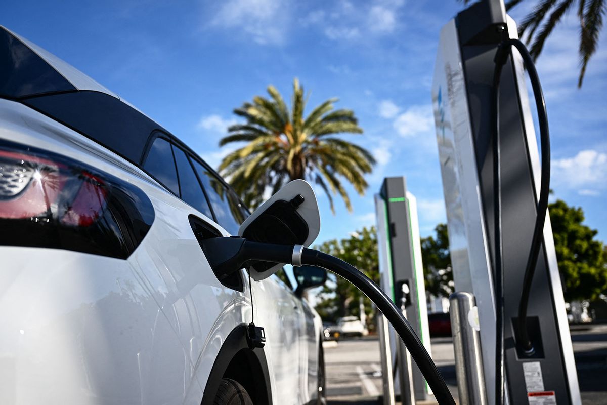 An electric vehicle (EV) charges via a CCS DC fast charger from Electrify America at a shopping mall parking lot in Torrance, California, on February 23, 2024. (PATRICK T. FALLON/AFP via Getty Images)