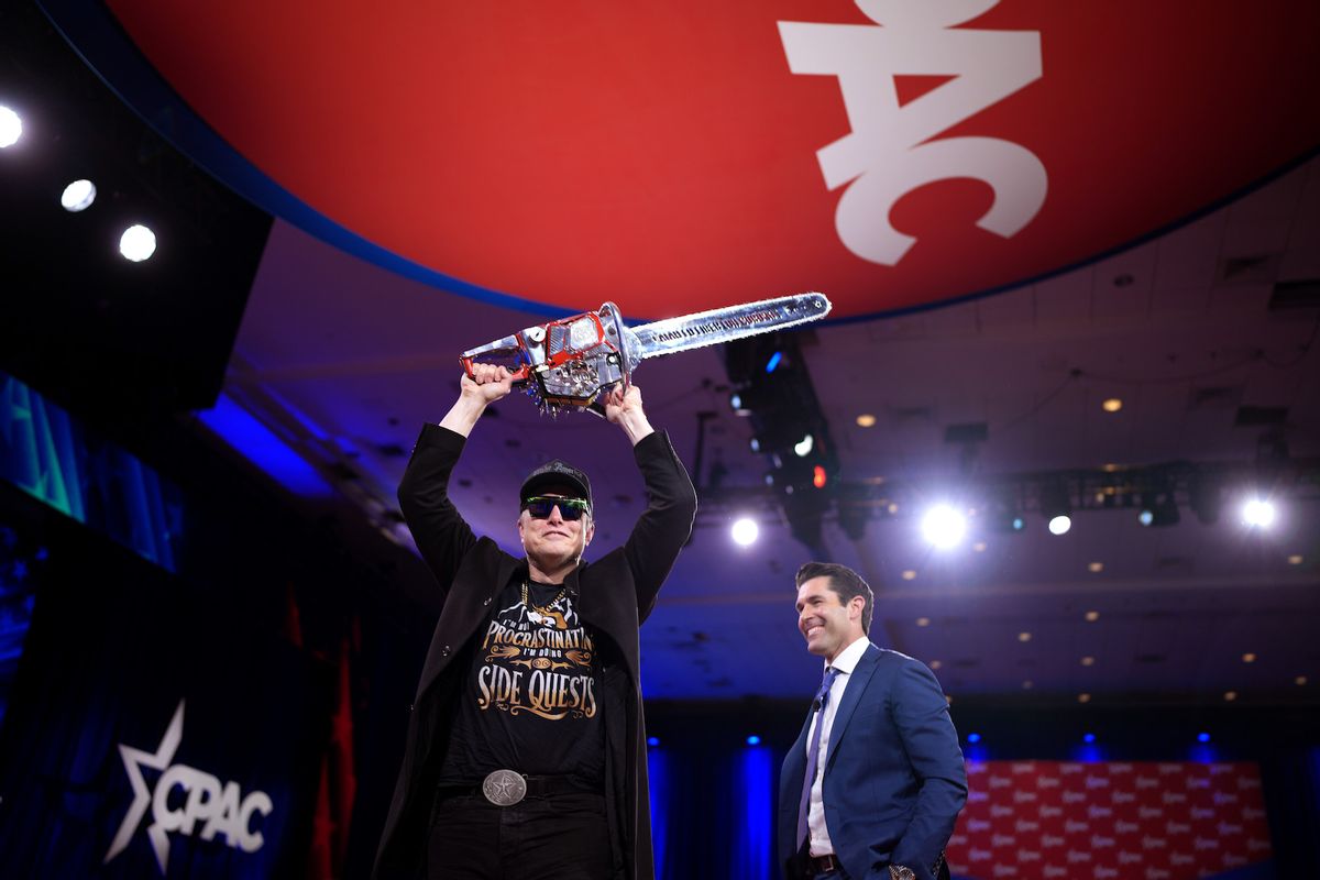 CEO of Tesla and SpaceX Elon Musk wields a chainsaw as he leaves the stage alongside Newsmax anchor Rob Schmitt at the Conservative Political Action Conference (CPAC) at the Gaylord National Resort Hotel And Convention Center on February 20, 2025 in Oxon Hill, Maryland. The annual four-day gathering brings together conservative U.S. lawmakers, international leaders, media personalities and businessmen to discuss and champion conservative ideas. Argentinian President Javier Milei gifted Musk the chainsaw that he used as a prop while campaigning. (Photo by Andrew Harnik/Getty Images)