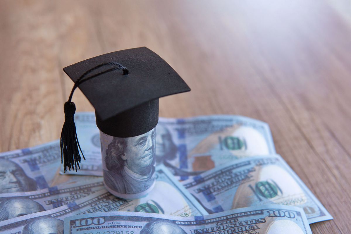 A graduation cap and money (Getty Images/mohd izzuan)